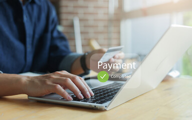 close up man hand and use credit card and type promotion code to make online payment after select...