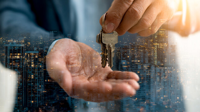 A real estate agent handing over keys to the new homeowner