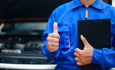 Technicians hold documents detailing maintenance history or technical data for customer service checklists to prepare repair reports for customers.