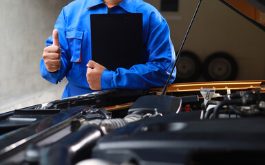 Technicians hold documents detailing maintenance history or technical data for customer service checklists to prepare repair reports for customers.