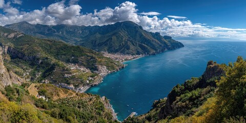 Panoramic view of a Mediterranean coastline with mountains and a town