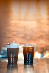 Iced Americano and iced mocha in plastic glass at cafe shop
