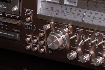 Vintage Audio Stereo Gear Setup Copper Front Panel with Multiple Controls Including Display, Knobs, Buttons, Keys, Switches