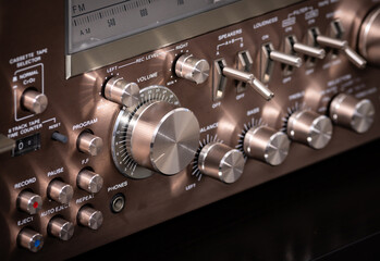Vintage Audio Stereo Gear Setup Copper Front Panel with Multiple Controls Including Display, Knobs, Buttons, Keys, Switches
