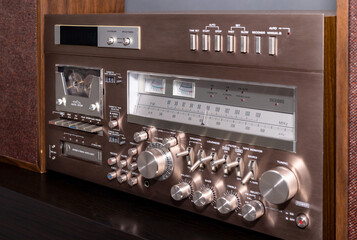 Vintage Audio Stereo Gear Setup Copper Front Panel with Multiple Controls Including Display, Knobs, Buttons, Keys, Switches