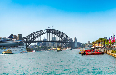Naklejka premium The Sydney Harbor Bridge is a heritage-listed steel through arch bridge, nicknamed The Coathanger because of its arch-based design and carries rail, vehicular, bicycle and pedestrian. Australia, 2019