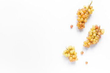 Many fresh green grape clusters isolated on white background.