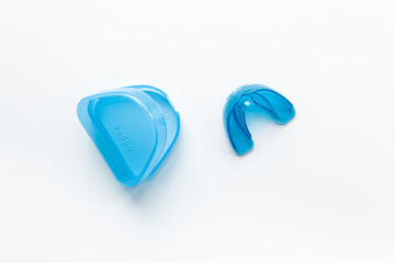 Orthodontic appliance for correction of teeth with a box on white background. Dental mouth guard