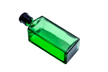 a green bottle of liquid on a white surface