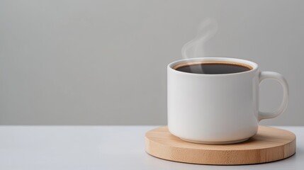 Hot Coffee Cup on Wooden Coaster with Steam Rising Against Minimalist Background