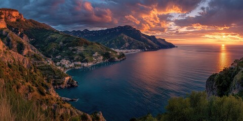 Dramatic sunset over coastal mountains and sea