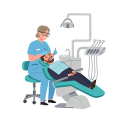 Dentist examining patient's teeth in dental chair