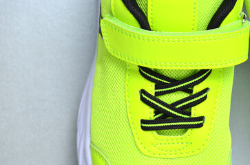 Sneaker laces close-up on a gray background.