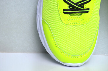 Part of sneakers close-up on a gray background.
