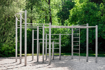 Sport Workout Gym Equipment Outdoor on Nature Background. Urban Modern Metal Horizontal Bars...