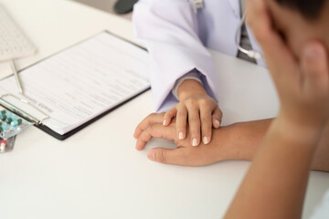 Healthcare Support. Doctor comforting patient during medical consultation.