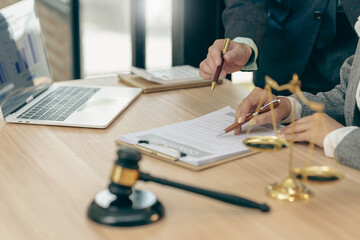 Courtroom, legal counsel with gavel and law. Justice and lawyer concept. Judge's gavel on table, close up.