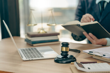 Courtroom, legal counsel with gavel and law. Justice and lawyer concept. Judge's gavel on table, close up.