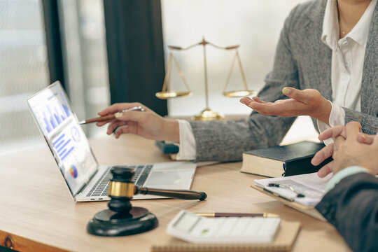 Courtroom, legal counsel with gavel and law. Justice and lawyer concept. Judge's gavel on table, close up.