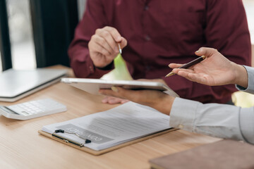 Business people discussing using financial document data charts and graphs. Business meeting. Financial analysis to determine business growth strategy and success.