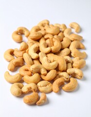 Fototapeta premium Close-up of cashews, showcasing their unique shape and inviting color ideal for themes of healthy snacks, vegan recipes, or wholesome ingredients. A collection of cashews, ready to be enjoyed 