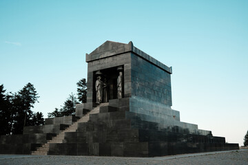 Side angle of the Monument to the Unknown Hero in Belgrade, Serbia. Solid granite structure with...