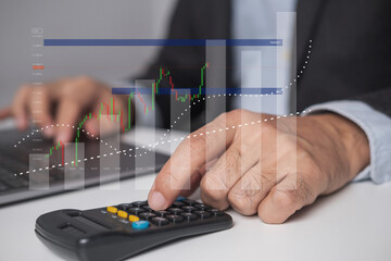 Closeup businessman hand doing finances and calculate on desk,