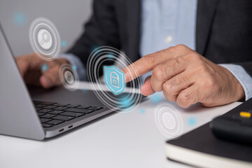 Close-up of businessman's hand touching virtual security application.
