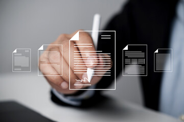 Businessman uses digital pen to sign virtual digital contact. E-signing on an e-document,