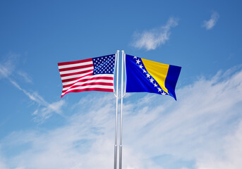 flags of  herzegovina and United States of America over blue sky background.