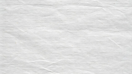 Fototapeta premium Close-up view of textured white paper with horizontal lines.
