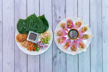 Mieng kham is a traditional snack from Thailand and Laos. The name "miang kham"