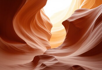 Smooth sandstone formations with flowing curves and warm tones in a natural canyon landscape