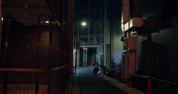 The street of the night city. The alley between the houses - Powered by Adobe