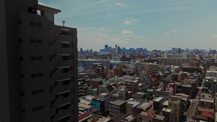 Tokyo from a bird's eye view. The drone flies over residential areas of the city