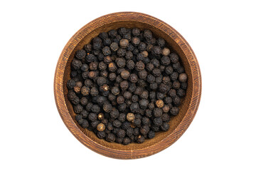 a wooden bowl filled with black pepper