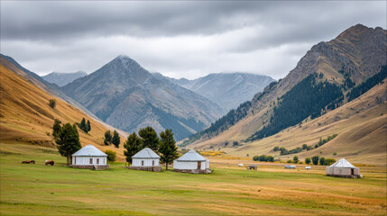 Yurt camp Suussamyr Valley with mountain landscape and cloudy sky