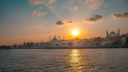 Sunset over istanbul city skyline with suleymaniye mosque and sea