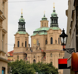 Exploring prague, majestic church standing tall between buildings