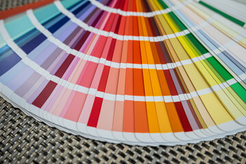 Color palette samples on woven black background for design and printing industry concepts