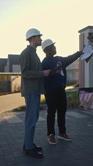 The managers of the construction company evaluate the result of the work standing near the object