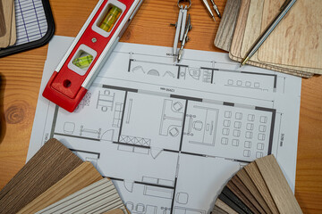Architect's Workspace: Blueprint, Measuring Tools & Material Samples for Home Design