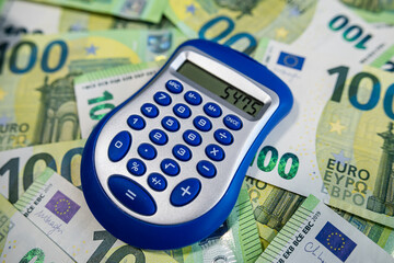 Euro banknotes with calculator, concept of personal finance, budgeting and money calculation