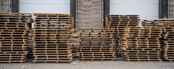 Stack of Wood pallets in front of loading dock