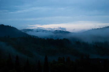 Light and mist blend into a dreamy mountain scene