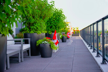 roof of building with plants and flag Canada