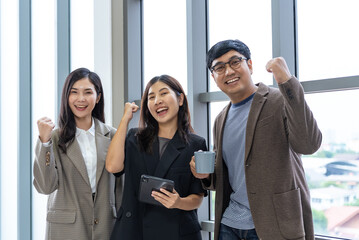 Happy diverse group Asian business start up freelance team analyzing statistics financial. Group...