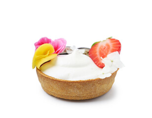 Delicious dessert. Tartlet with cream, berries and flowers isolated on white