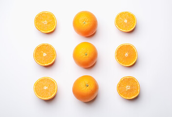 Fresh whole and cut oranges on white background, flat lay