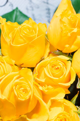 A luxurious bouquet of yellow roses. Bunch of many colorful fragrant flowers. Floristry and floral design concept. Floral texture. Vertical